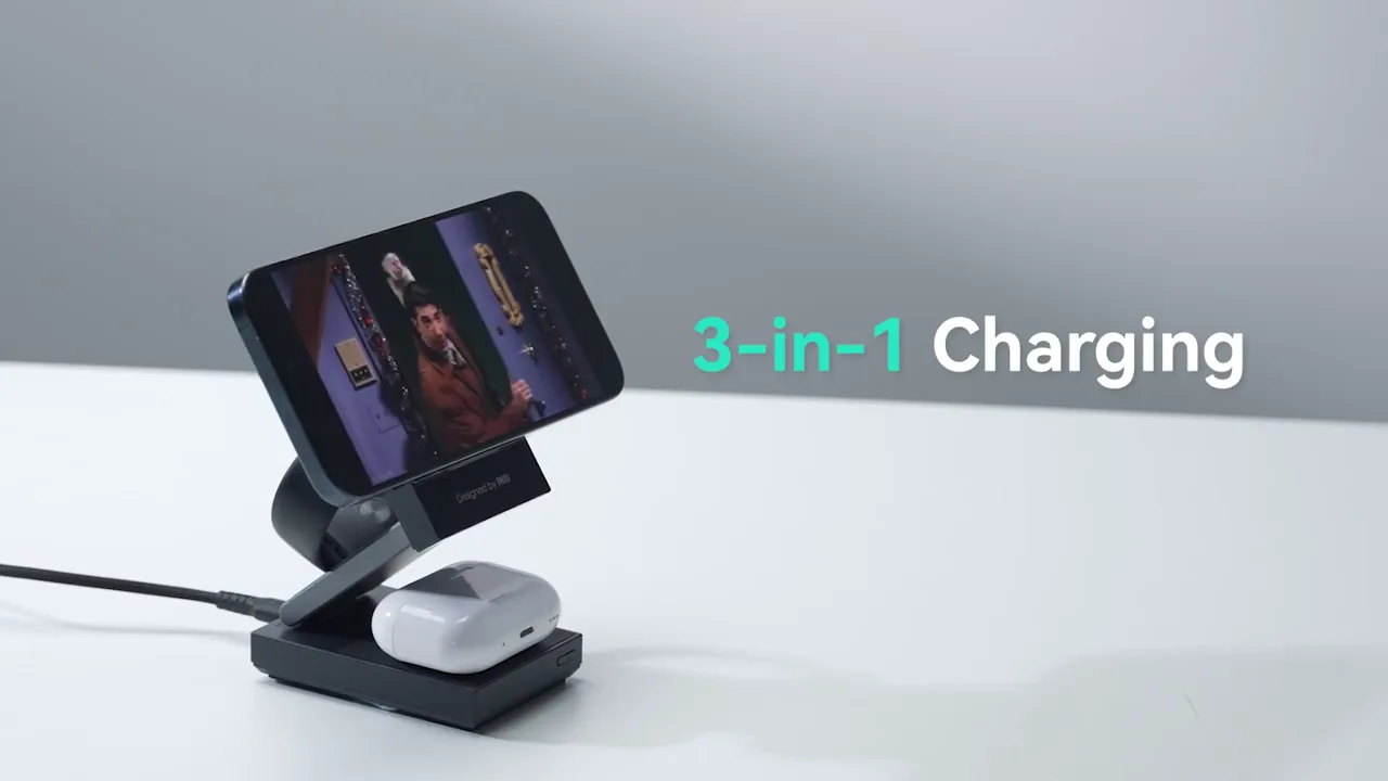 A foldable wireless charging stand holding a phone, watch and earbuds